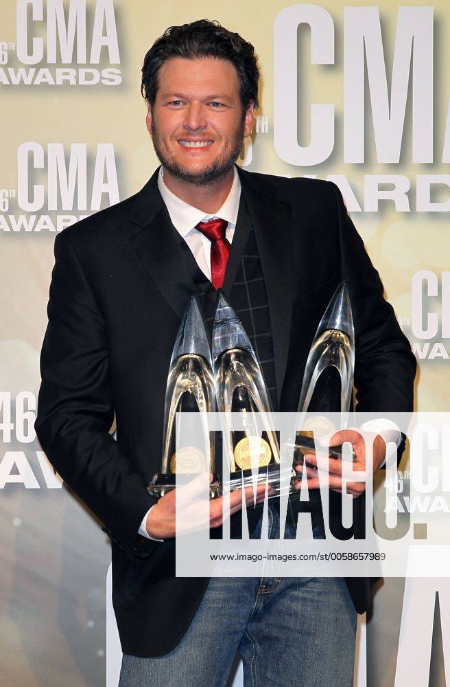 Blake Shelton, winner of Entertainer of the Year, Male Vocalist of the Year and Song of the Year, poses with his trophies backstage at the 2012 Country Music Awards at the Bridgestone Arena in Nashville on November 1, 2012. CMA20121101164