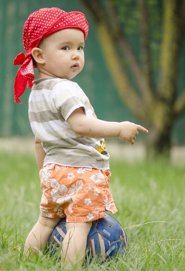 Sweer baby girl with a football, Sweer baby girl with a football in the garden model released