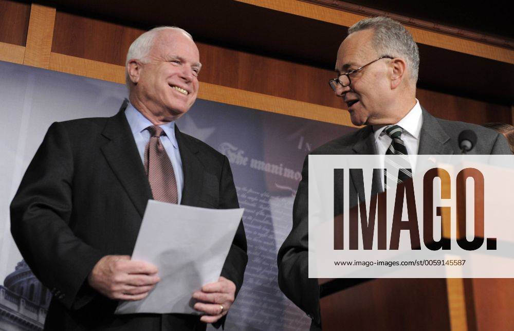 Sen. Charles Schumer (D-NY), (R) smiles at Sen. John McCain (R-AZ) as he makes remarks on a bi-partison plan to introduce immigration reform, at the US Capitol, January 28, 2013, in Washington, DC. The legislation follows the so-called Dream Act , a comprehensive path to citizenship for millions of illegal aliens in the US. WAP20130128502