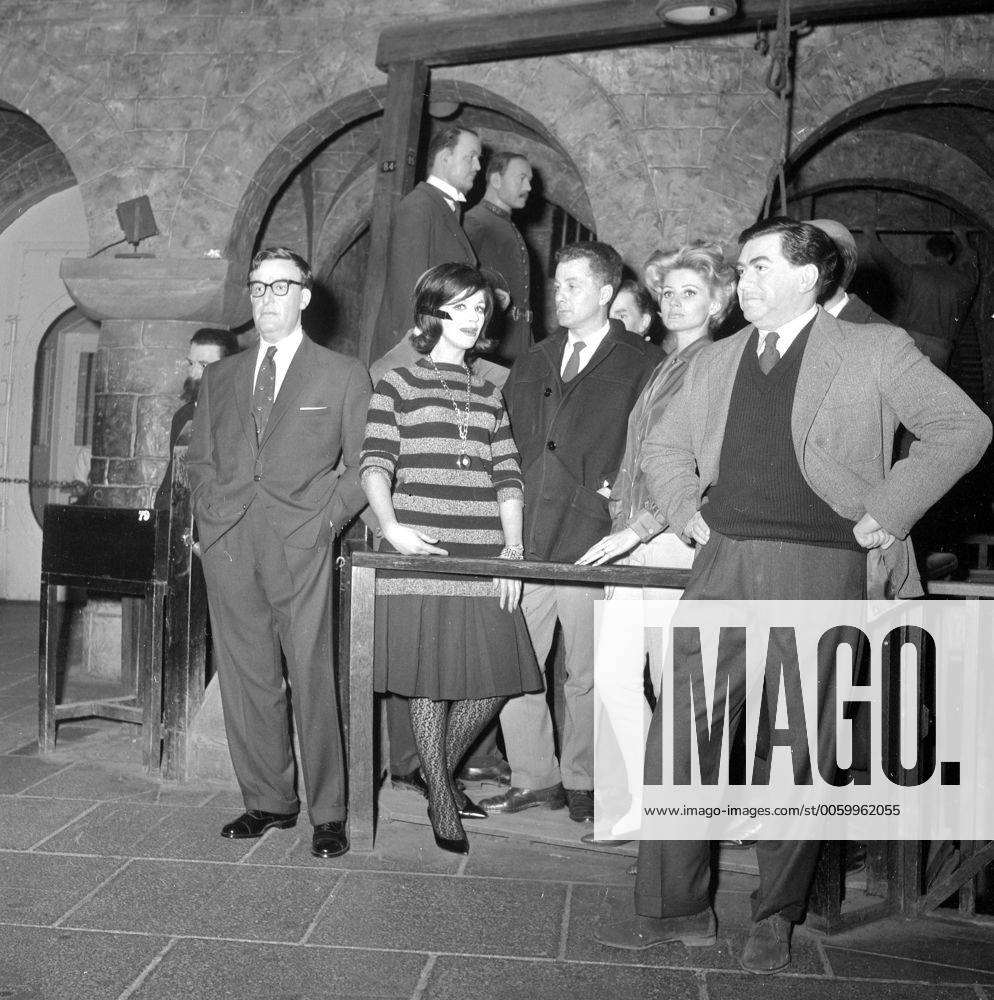 London: Surrounded by heavenly men, darling , is what actress Fenella Fielding (striped sweater) appears to be saying when she visited Madame Tussauds waxworks - Chamber of Horrors section - today, but the two figures, left and extreme right, are Peter Sellers and Antony Hancock, esq., made in wax, whilst the others with Fenella are the real thing. Actor Alan Edwards (centre) and actress Jill Ireland. The three are taking part in the midnight matinee the old Drury Lane melodrama, The Whip which is being revived at the Metropolitan Theatre in London s Edwards Road on May 16th. Sellers and Hancock will be appearing Live in the waxworks partly shown in this picture are Landru (Bluebeard) and Frederick Seddon. Darling these men rally do make my blood run cold , and Fenella cheerfully shuddered. May 16th performance is staged by the Friends and Centre 42 committee in aid of Centre 42 UnitedArchives00203412