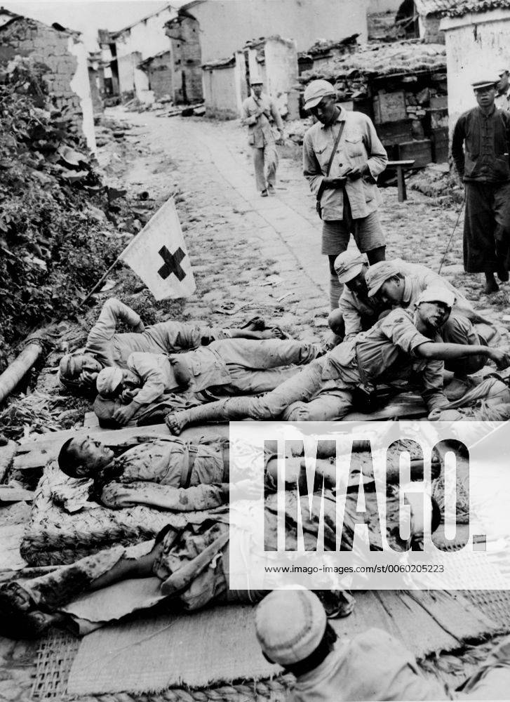 Chinese-Japanese War: Chinese troops wounded during their successful battle to liberate Tengchung receive treatment at a make-shift first aid station in the old Chinese city. UnitedArchives01008707