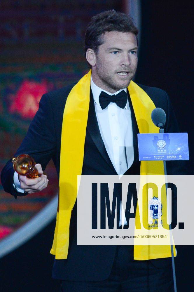 MACAO, Oct. 7, 2013 - Australian actor Sam Worthington receives the Global Best Action Perfomer award at the awarding ceremony of the 10th Huading Awards, the release ceremony of the Global Entertainment Celebrities Satisfaction Survey, in Macao, south China, Oct. 7, 2013. (Xinhua Cheong Kam Ka) (wr) CHINA-MACAO-HUADING AWARDS (CN)