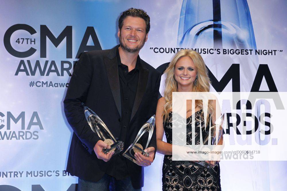 Blake Shelton, winner of Male Vocalist of the Year, and his wife Miranda Lambert, winner of Female Vocalist of the Year, poses backstage during the 47th Annual Country Music Awards at Bridgestone Arena in Nashville on November 6, 2013. CMA20131106312