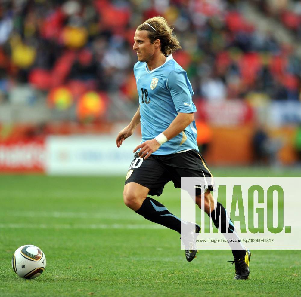 Diego Forlan of Uruguay breaks through during the 2010 World Cup round of 16 soccer match against South Korea at Nelson Mandela Bay stadium in Port Elizabeth, on June 26, 2010.