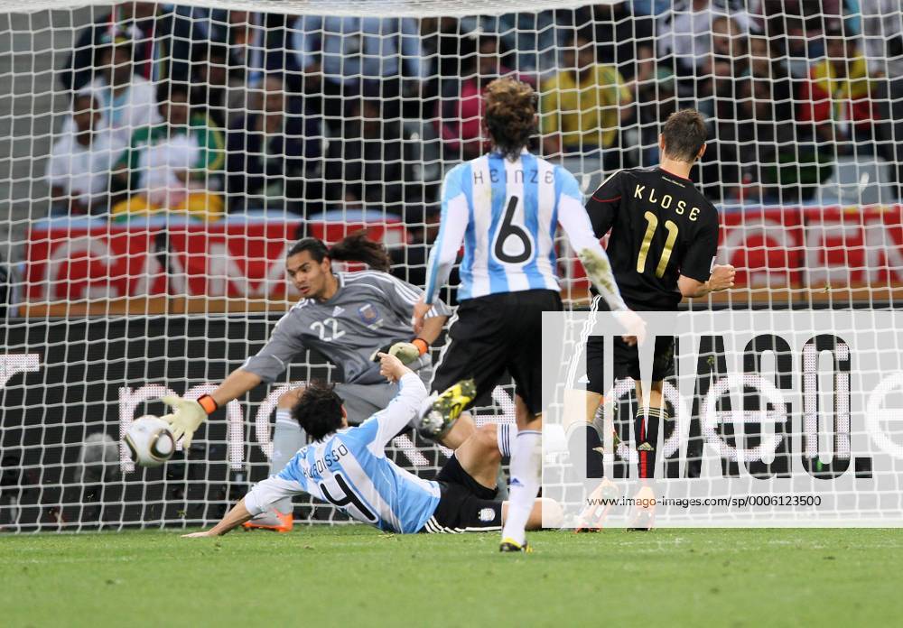 Germany s Miroslav Klose (R) scoring his sides fourth goal FIFA World Cup 2010 QuarterFinals Argentina v Germany 3rd July, 2010 .