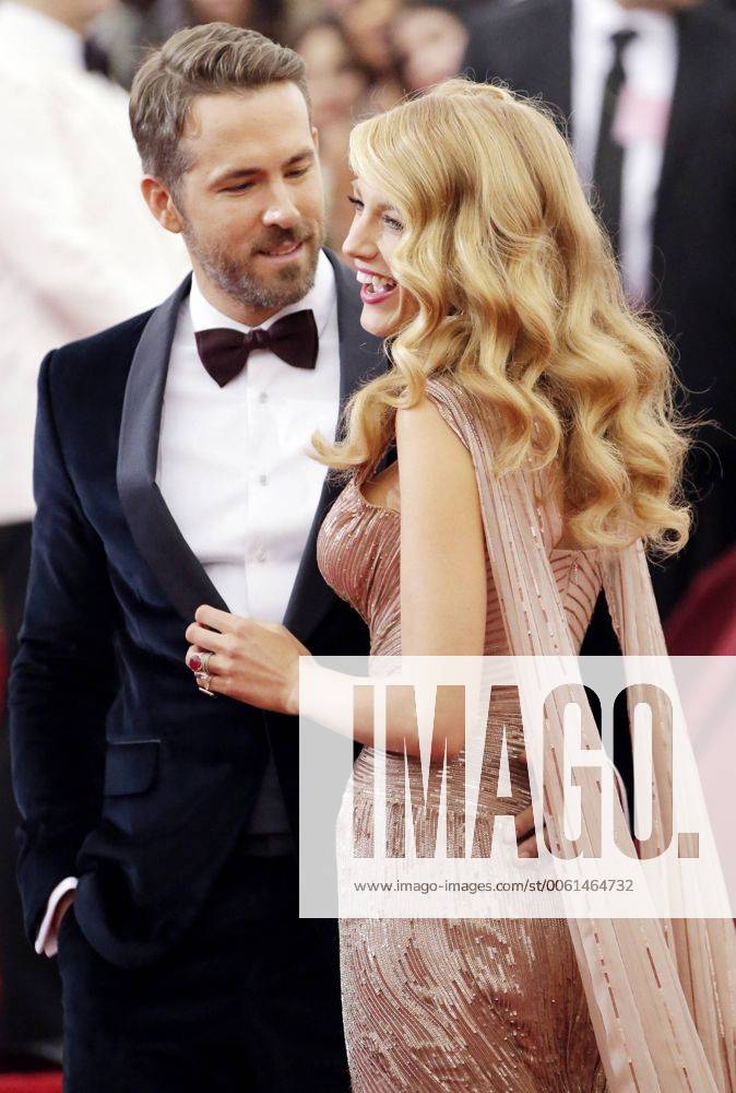 Blake Lively and Ryan Reynolds arrive on the red carpet at the Costume Institute Benefit celebrating the opening of Charles James: Beyond Fashion and the new Anna Wintour Costume Center at the Metropolitan Museum of Art in New York City on May 5, 2014. NYP20140505148