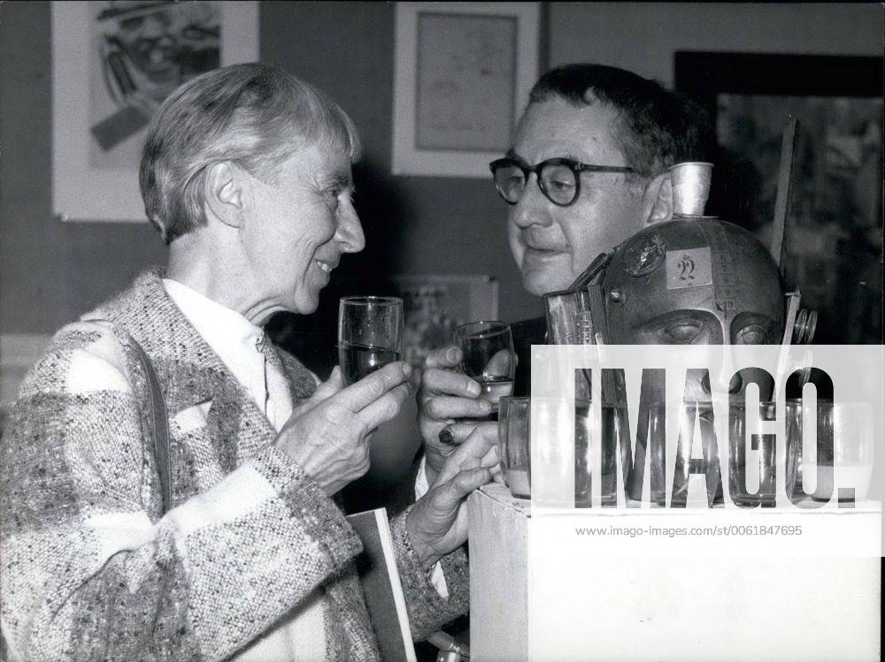 Sep. 09, 1958 - Dada-Exhibition in D&uuml;sseldorf The greatest Dada-Exhibition in Germany after the war begins on Friday, Sept. 5th in the nail of Arts in D&uuml;sseldorf. OPS: Man Ray from New York and Hanna Hoech from Berlin during the press-reception. They have a drink at the exhibition-piece No. 398 the mechanic head - ZUMAk09