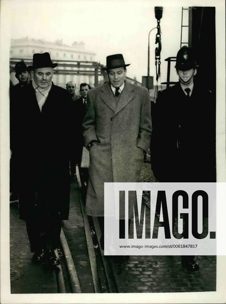 Feb. 02, 1959 - Dr. Otto John leaves: Dr. Otto John, the 49-year old former West German security chief, was escorted by police on to the cross-channel steamer Prince Philippe at Dover today, after being declared an undesirable alien . He was refused permission to land yesterday afternoon after arriving aboard the Prince Philippe from Ostend. Dr. John spent the night aboard the ship and was transferred to a police cell on Dover Marine station for breakfast. His wife, Mrs. Lucie John, of Netherhall Gardens, Hampstead, London, tried to telephone him but Dr. John was not allowed to take the call. Photo Shows: Dr. Otto John (in center) is escorted back to the cross - Channel steamer, at Dover today. - ZUMAk09