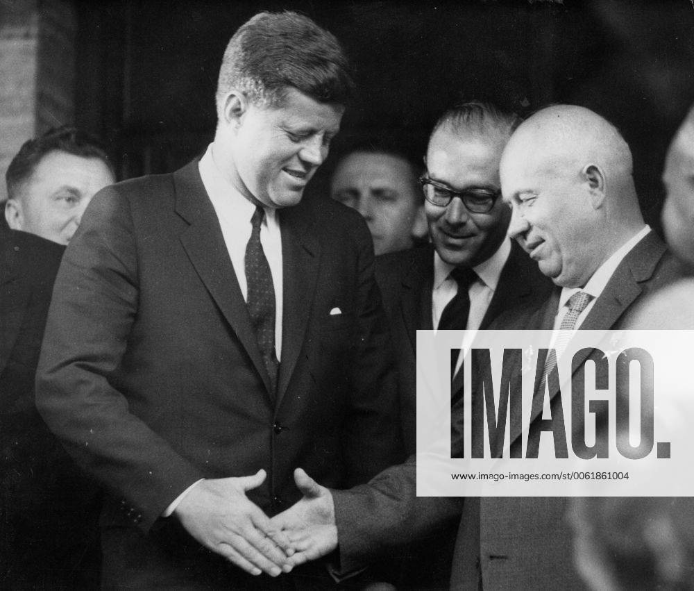 Vienna, Austria - President JOHN F. KENNEDY of the United States, greeted Mr. NIKITA KHRUSHCHEV with a handshake, when the Russian leader arrived at the United States Embassy in Vienna to start their talks. Vienna Austria - ZUMAk09