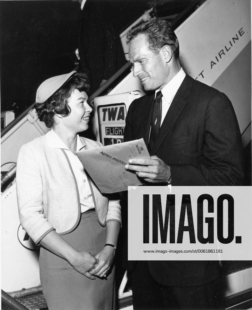 Oct. 6, 1961 - New York, NY, U.S. - Actor CHARLTON HESTON known for his religious roles in Ben-Hur and The Ten Commandments , with TWA hostess PAT SELZ as he arrived in New York. New York United States of America - ZUMAk09