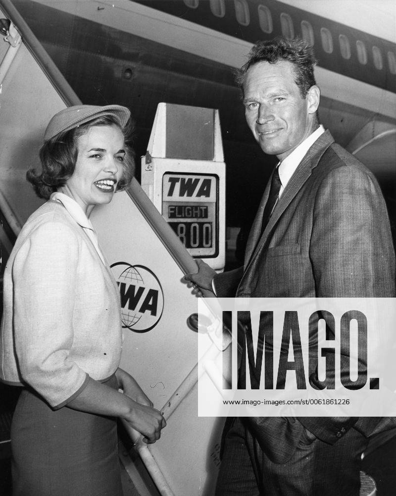Nov. 3, 1961 - Rome, Italy - Actor CHARLTON HESTON known for his religious roles in Ben-Hur and The Ten Commandments , pictured with TWA hostess, NANCY FATENAUDE as he boards the plane to Berlin from Rome. Rome Italy - ZUMAk09