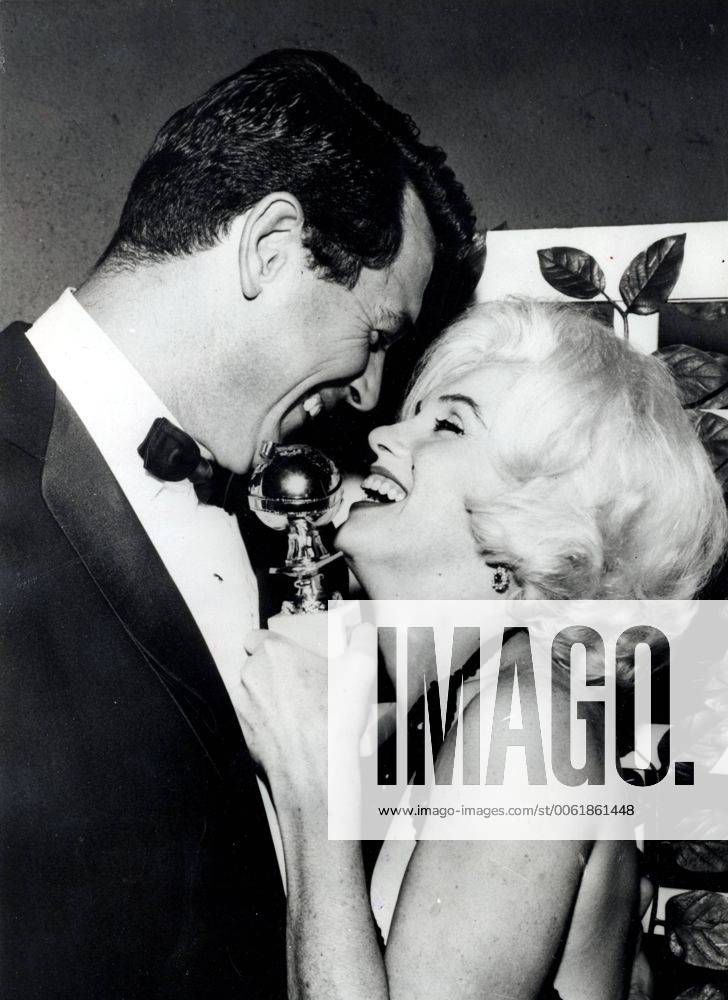 IMAGO ICONS: Marilyn Monroe Mar. 13, 1962 - Los Angeles, CA, U.S. - Actress MARILYN MONROE after receiving The Golden Globe Award sharing her happy moment with ROCK HUDSON, who just passed her the award. Most endlessly talked-about and mythologized figure in Hollywood history, Marilyn remains the ultimate superstar. Impossibly alluring, she defined the very essence of screen sexuality and the camera adored her. Los Angeles United States of America - ZUMAk09
