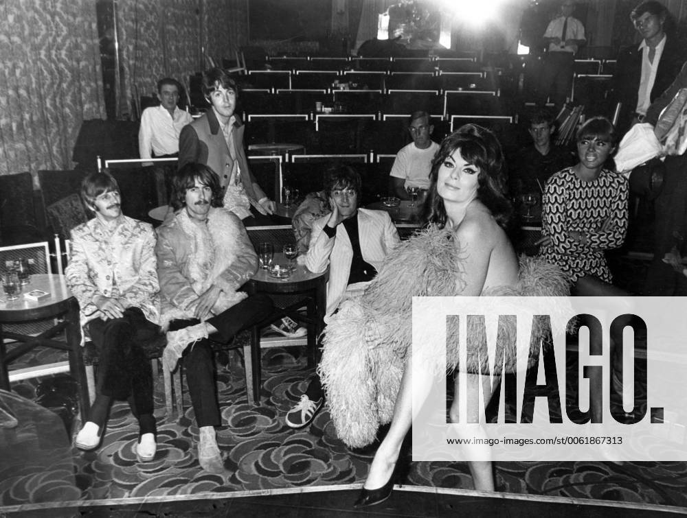 Apr. 18, 1967 - London, England, U.K. - Stripteaser JAN CARSON in new BEATLES film Magical Mystery Tour . In the back are (from L-R) RINGO STARR, GEORGE HARRISON, PAUL McCARTNEY and JOHN LENNON. London UK - ZUMAk09