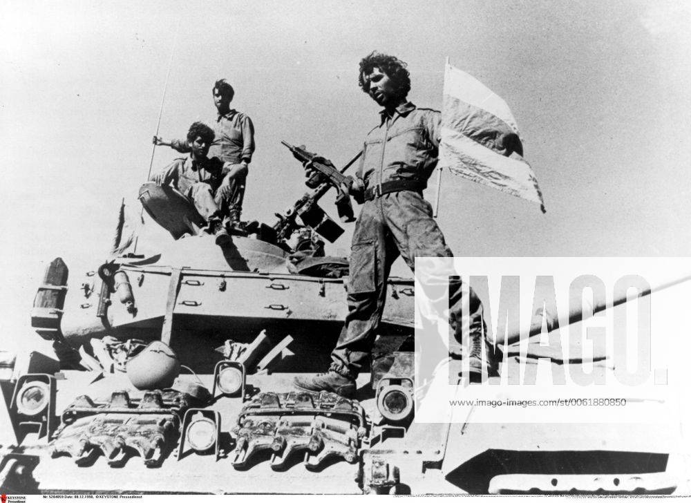 Oct 01, 1973 - Golan Heights, Israel - Also known as the Fourth Arab-Israeli War, Yom Kippur War was fought from October 6 to October 26, 1973 by a coalition of Arab states led by Egypt and Syria against Israel. The war began with a surprise joint attack by Egypt and Syria on the Jewish holiday of Yom Kippur. Egypt and Syria crossed the cease-fire lines in the Sinai and Golan Heights, respectively, which had been captured by Israel in 1967 during the Six-Day War. Many Arab states contributed troops and financial support, and the USSR also provided assistance but ultimately the Arabs buckled under a sustained Israeli counter-attack strengthened by US airlifts. PICTURED: An Israeli soldier on a tank. Golan Heights Israel - ZUMAk09