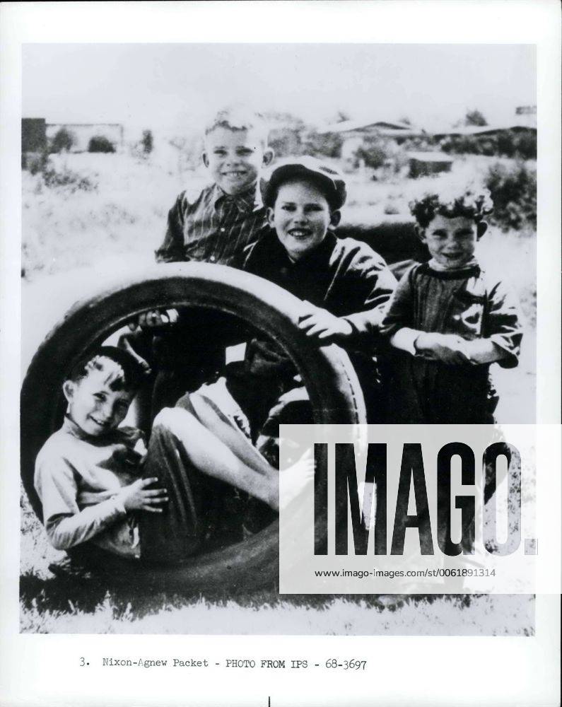 The Nixon brothers pause for a picture during a play session in Yorba, Linda, California. Richard, age 9, is standing at left beside Harold, 12; Arthur, 4; and Donald, 7, in tire. Another brother, Edward, was born several years later. - ZUMAk09