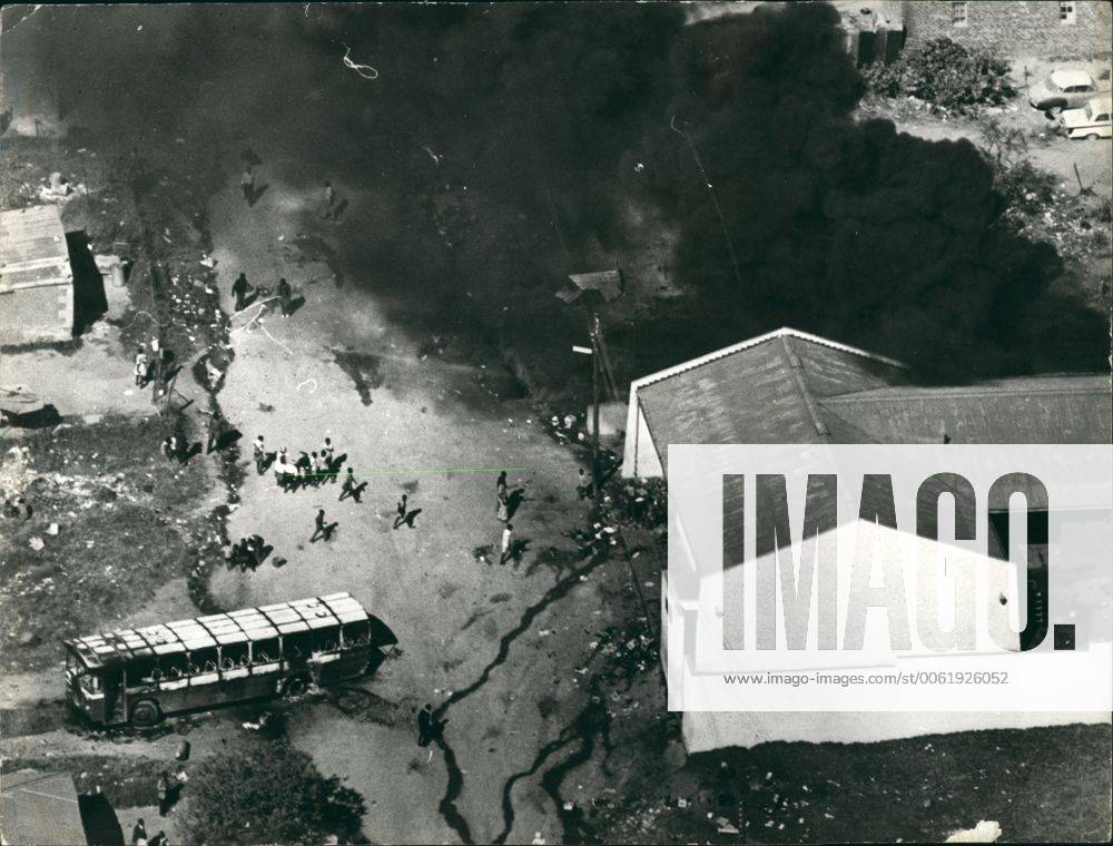 Jun. 06, 1976 - 100 People Killed And More Than 1,000 Injured In South Africa s Worst Outbreak Of Civil Unrest : The Wrest outbreak of civil unrest in South Africa has claimed the lives of 100 people, and more than 1,000 have been injured in rioting at Soweto, the African township outside Johannesburg. The rioting began during a March by black students against the use of African s in lessons. Police opened fine and cars and buildings were set on fire. Photo Shows A beer hall in set on fire by the rioters in Soweto on the left is a burnt-out bus. - ZUMAk09