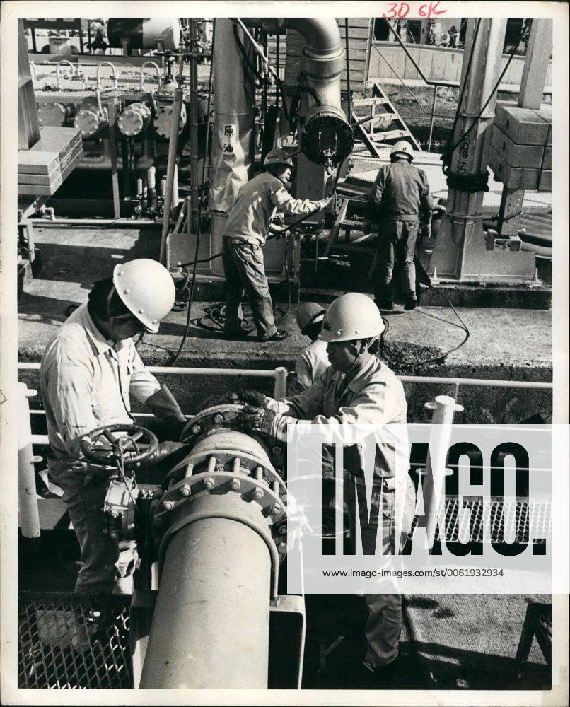 Apr. 04, 1979 - Workers prepare to unload crude oil into storage tanks at Showaoil Co. s storage facility on Ohgishima Island. New York U.S. - ZUMAk09