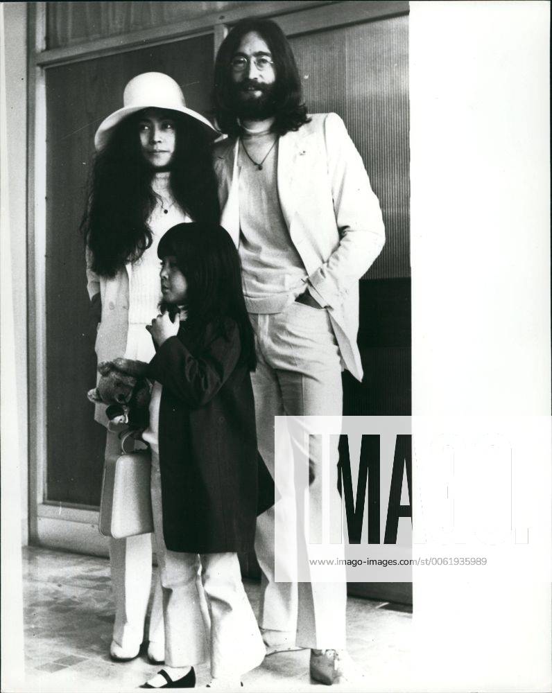Dec. 12, 1980 - John Lennon Shot Dead: Former Beatles John Lennon was shot dead at his apartment in New York City Last Night. Photo Shows John Lennon and his wife Yoko Ono with her daughter by her previous marriage Yoko Pictured at London Airport in May 1969 leaving for his ~ to stage a seven day Bed-in- for-peas . This was their second Bed-in their first was held a month previously in Amsterdam. Lennon chose the Be hams as the nearest British settlement to the U.s. -he had been refused a U.s. visa because of a drug conviction. - ZUMAk09