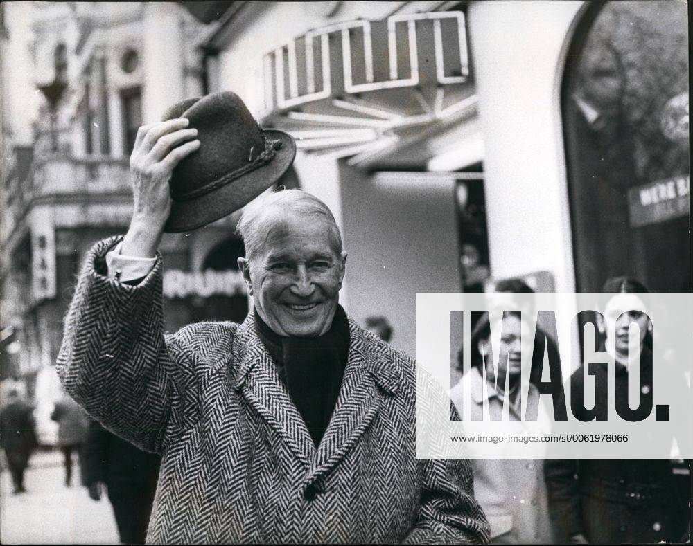 Feb. 02, 1968 - Maurice Chevalier here for farewell concert tour he joins the Queue to see the film Camelot : Maurice Chevalier, the most durable entertainer, and the most popular Frenchman in the world, has arrived in London. Now nearly 80, he is here to make a farewell tour of Britain doing a series of one-man concerts, all one-night stands, starting in Manchester on Feb 13th, and coming to the London Palladium on Sunday Feb 18th. This afternoon Maurice went along to the Warner Cinema to see the film Camelot . Photo shows Maurice Chevalier doffs his hat as he walks through Leicester Square on his way to see the film Camelot at the Warner Cinema this afternoon. - ZUMAk09