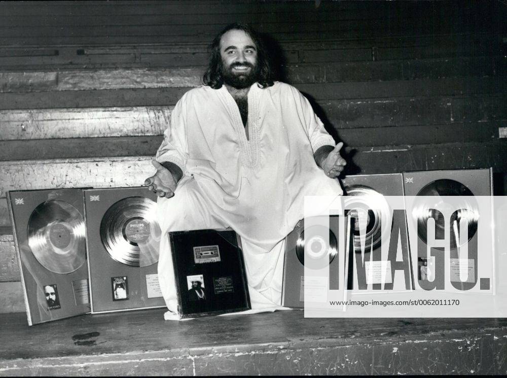 Oct. 10, 1976 - International singing star Demis Roussos is presented with Gold and Silver awards at the Royal Albert Hall: International singing star, Demis Roussos, was last night awarded a silver disc for his L. P. Fire and Ice , denoting U. K. sales exceeding ?100,000: gold discs for his L. P. s Happy to be , My only Fascination and Souvenirs , denoting U. K. sales exceeding ?250,000; also a siver disc for exceeding 250,000 copies; plus a gold cassette for Forever and ever , the album of which has been gold in the U. K. for over a year. The awards were presented to Demis at the end of his 3rd sell-out concert at the Royal Albert hall last night. Photo shows Demis Roussos pictured with his award at the Royal Albert Hall last night. - ZUMAk09
