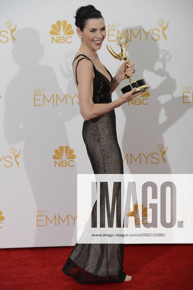 Julianna Margulies, winner of Outstanding Lead Actress In A Drama Series for The Good Wife appears backstage at the Primetime Emmy Awards at the Nokia Theatre in Los Angeles on August 25, 2014. LAP20140825185