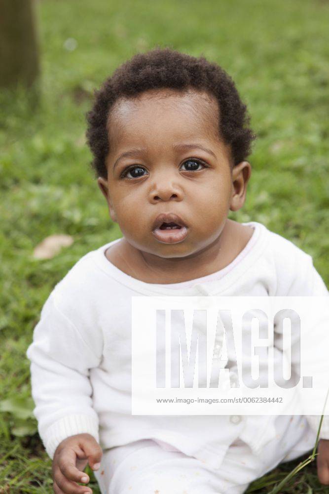 South Africa, KwaZulu-Natal, Eshowe, Baby boy sitting in grass MF000593