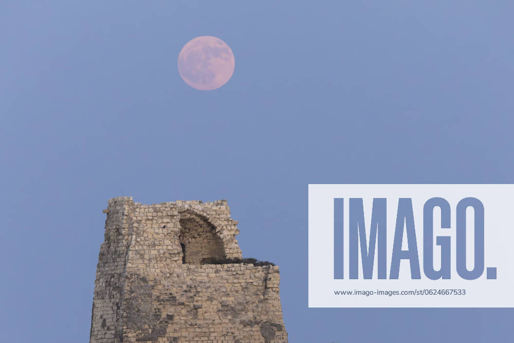 Strawberry Moon In Italy The full moon rises behind over the Tower of Roca Vecchia in Roca Vecchia, Lecce, Italy, on June 21, 2024. Roca Italy