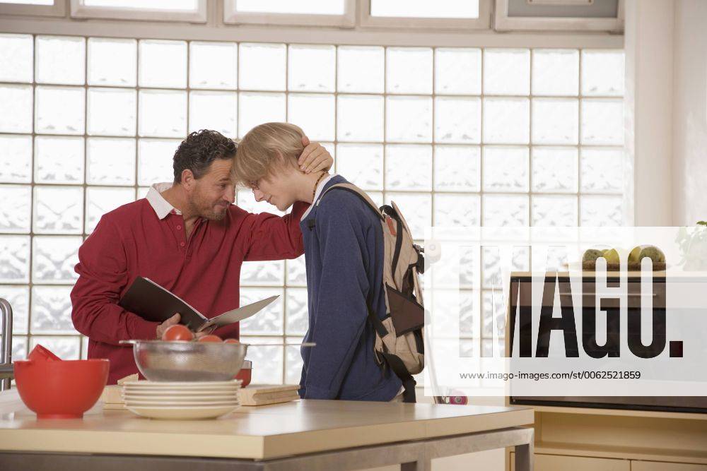 Father and son in kitchen model released property released WESTF03314