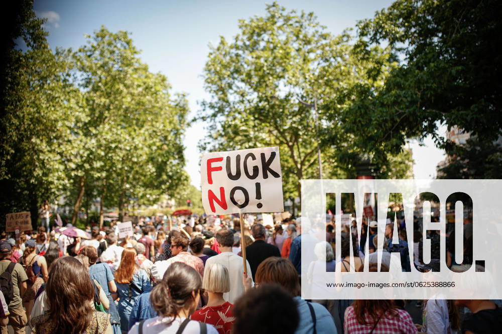 Protest in Paris, France - 23 Jun 2024 (EDITOR S NOTE :Image depicts profanity) A protester holds a placard expressing opinion amid a large crowd of protesters during the demonstration. One week before the first round of the legislative elections, which will take place on Sunday June 30, 200 feminist groups and associations called for a demonstration against the far right and the National Rally party. Paris France