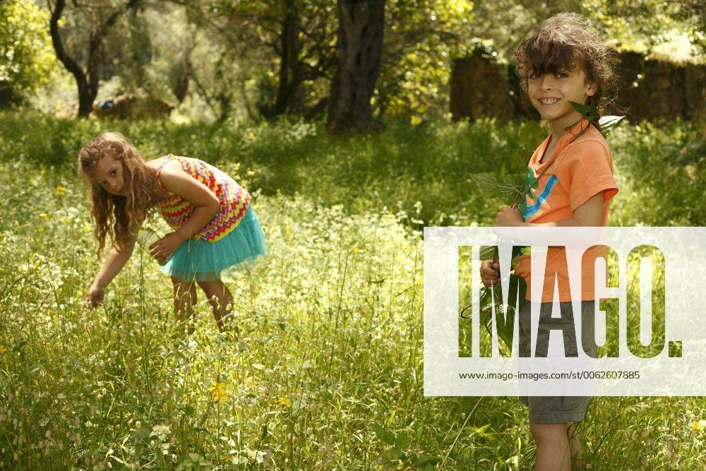Greece, Ionic Islands, Corfu, boy and girl exploring the wilderness model released AJF000051