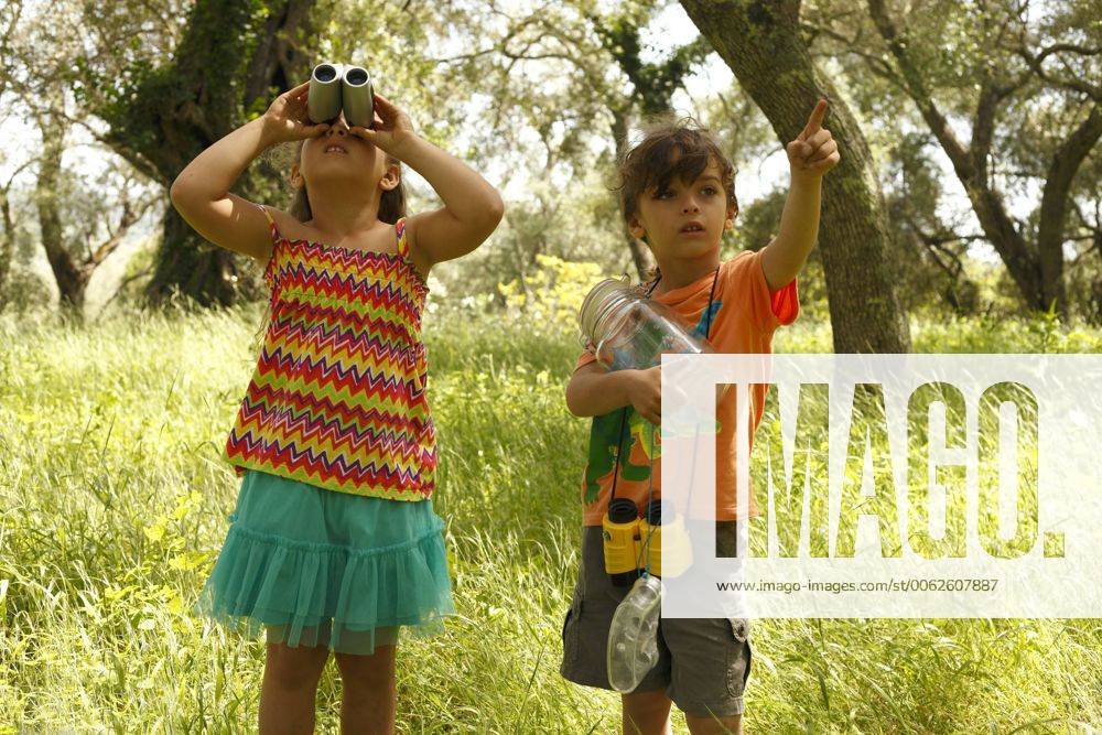 Greece, Ionic Islands, Corfu, boy and girl exploring the wilderness model released AJF000053