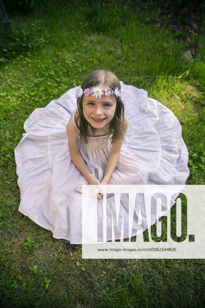 Girl in white summer dress on meadow model released SARF000668