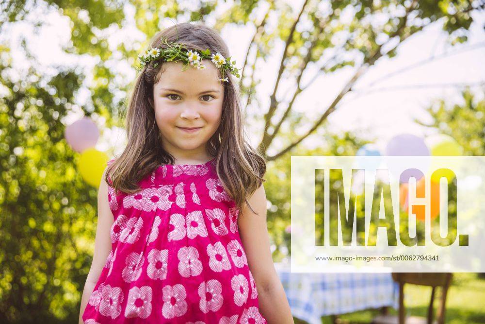 Portrait of girl standing in front of her birthday table in garden model released Symbolfoto property released MFF001271