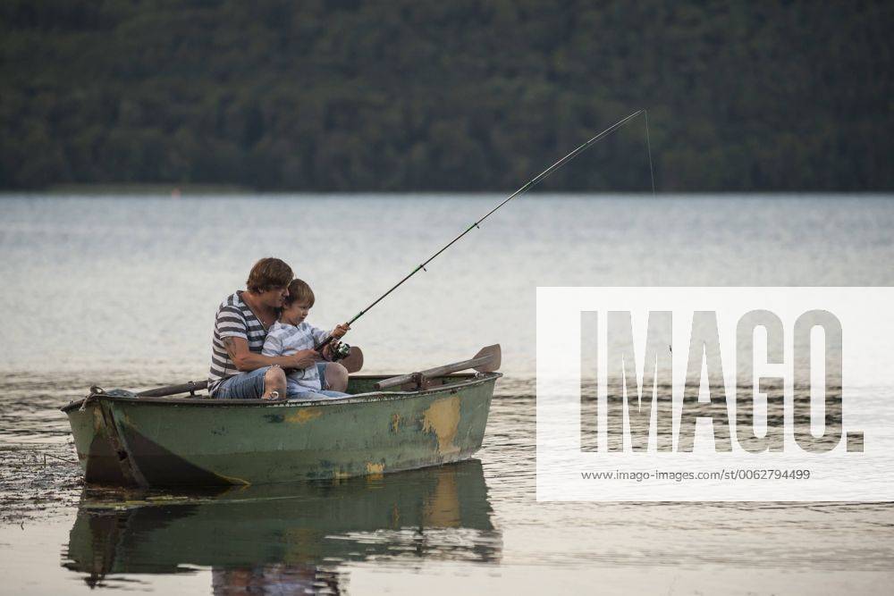 Germany, Rhineland-Palatinate, Laacher See, father and son fishing from boat model released Symbolfoto PAF000916