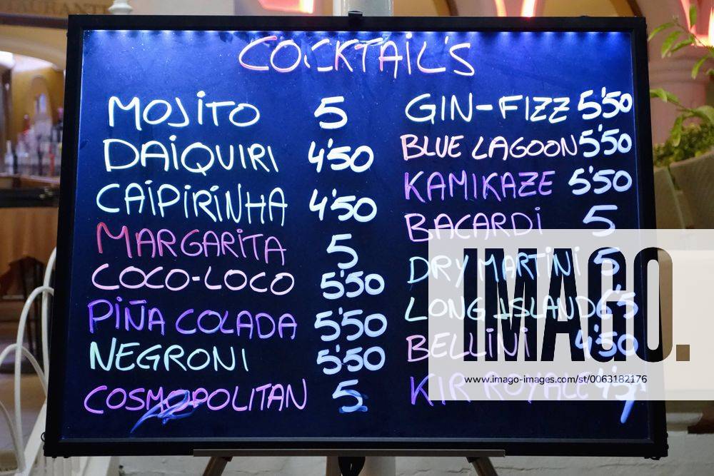 Spain, Ibiza, Santa Eulalia, board with cocktails at a bar NDF000477
