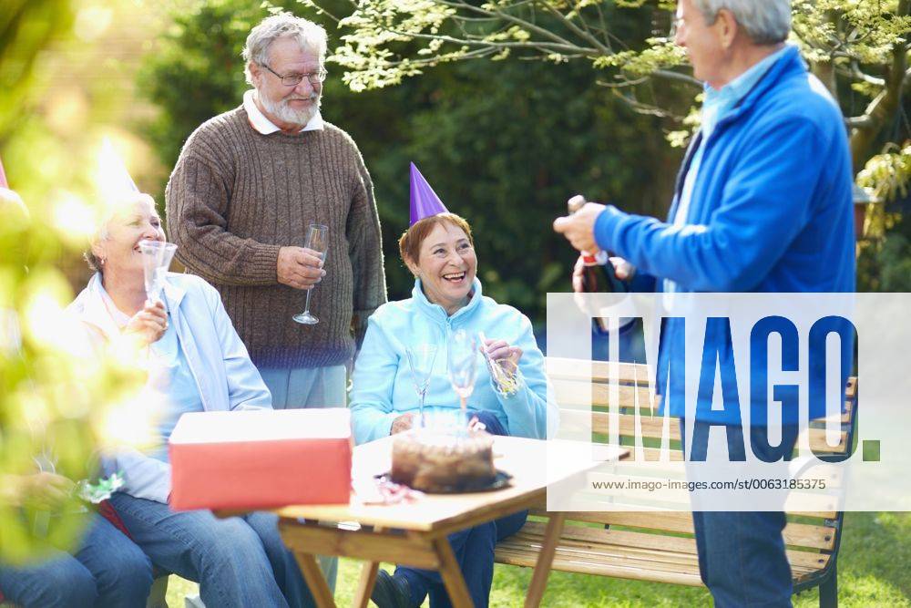 Senior friends on a birthday garden party model released Symbolfoto ZEF001029