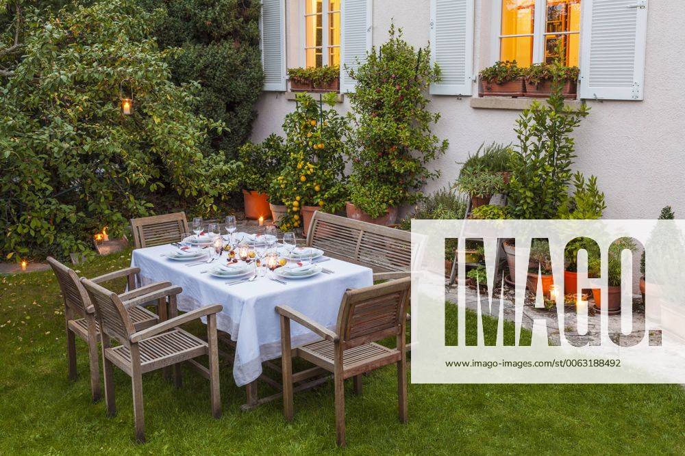 Autumnal laid table in garden in the evening property released WDF002730
