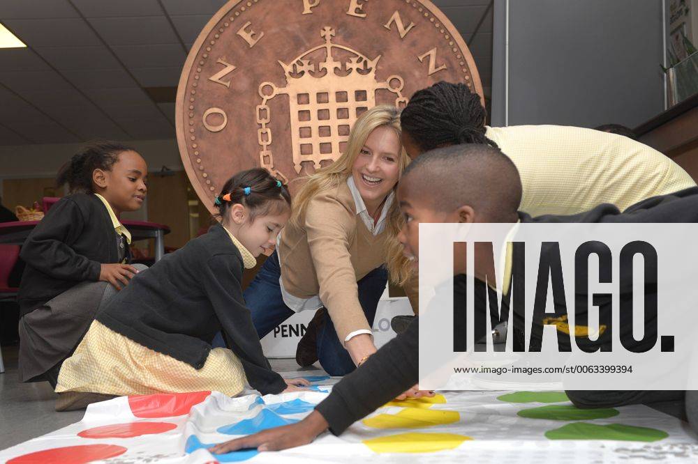 . 18 12 2014. London, United Kingdom. Penny Lancaster visits Charlton Manor Primary School where the Mayors Fund initiative Penny for London is raising money to fund breakfasts for school children. Penny Lancaster plays Twister with children at breakfast club. Stevensx xi-Imagesx IIM-3778-0004