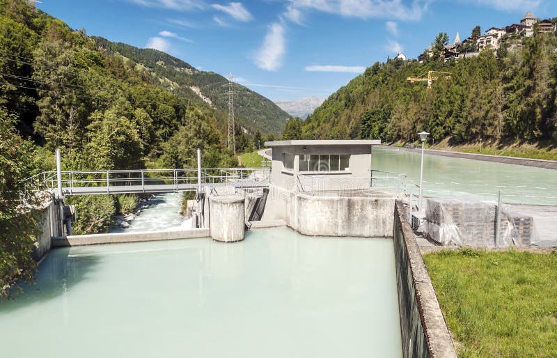 Hydroelectric power station, Hydroelectric power station with trees in the mountains of the Swiss Alps of St Luc, on a sunny day.