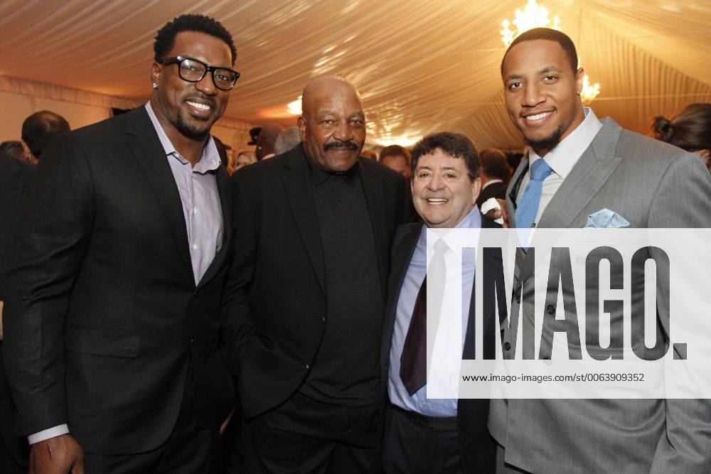 Feb. 28, 2015 - Tampa, Florida, U.S. - Patrick Willis, Jim Brown, Eddie DeBartolo, and Eric Reid pose for a photo at the DeBartolo Family Foundation 12th Annual All Star Charity Gala at Peter O Knight Airport in Tampa. Tampa U.S. - ZUMAs70_