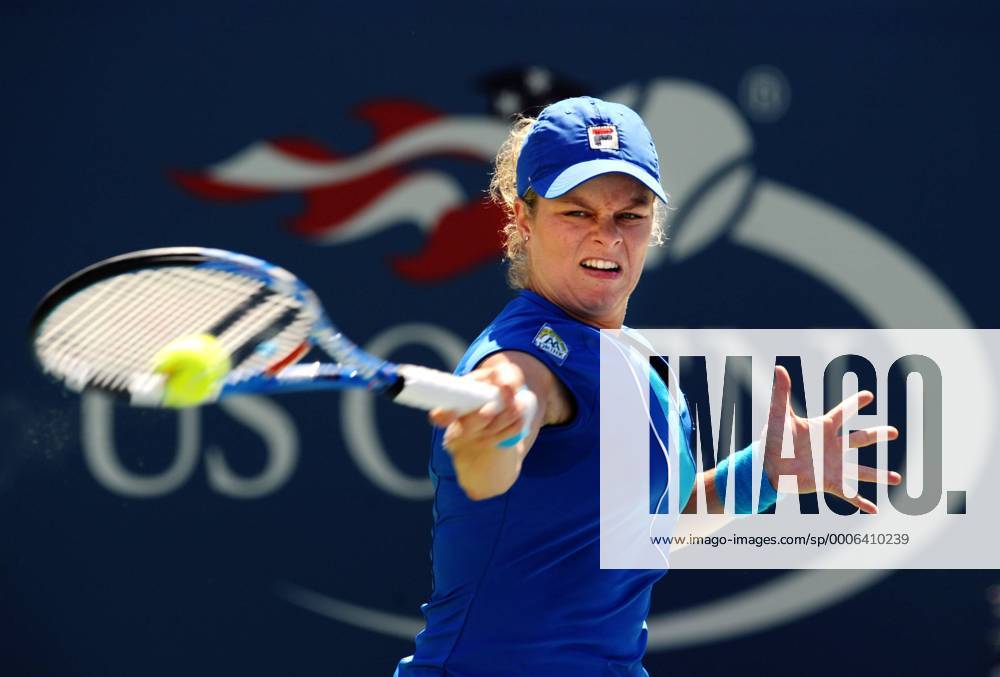 Kim Clijsters of Belgium returns the ball