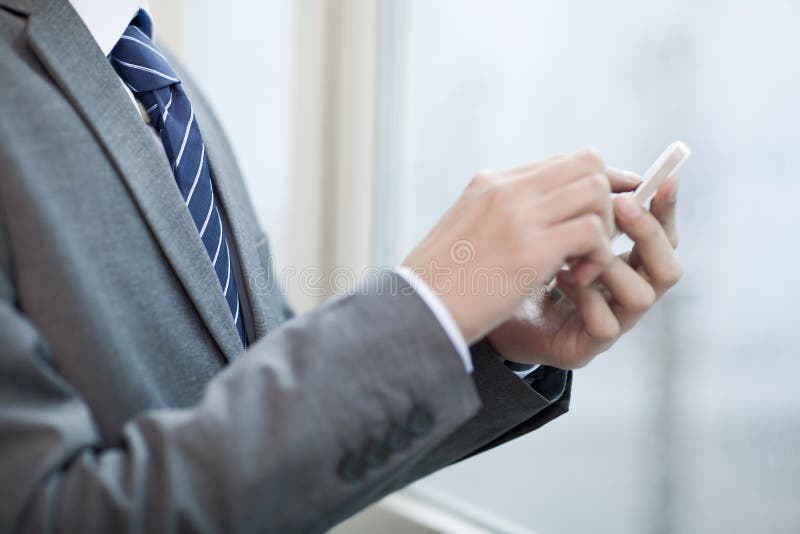 Portrait of young bisinessman using cell phone, Portrait of young