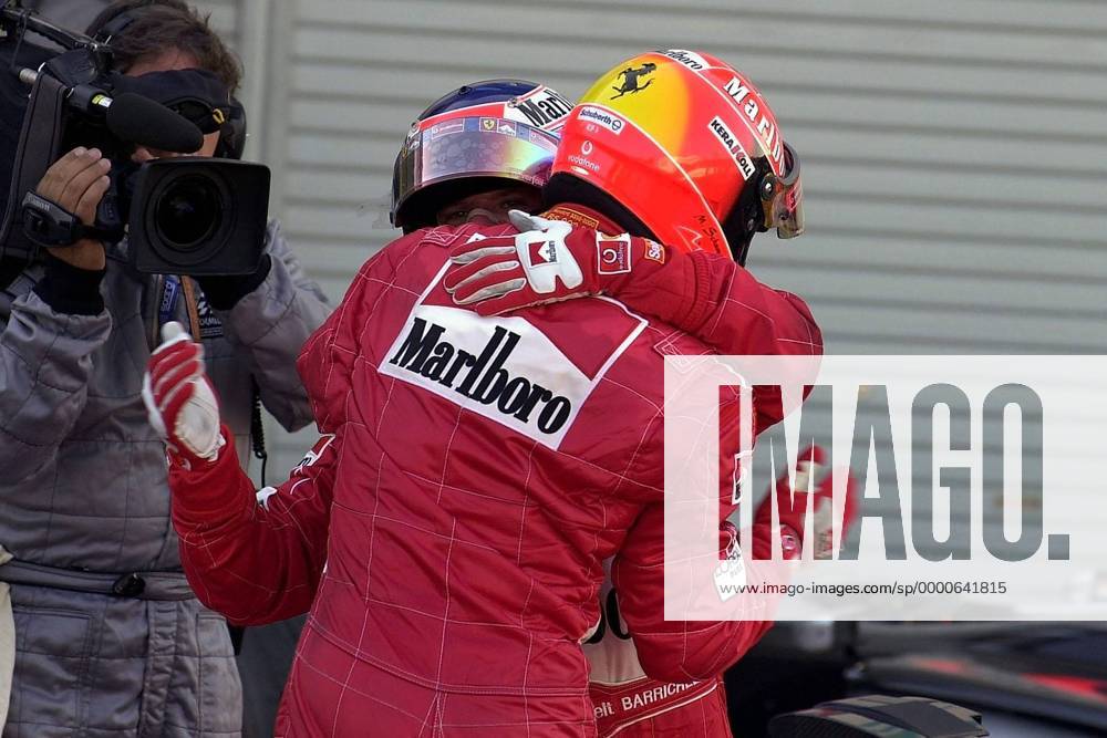 Michael Schumacher (vorn, Deutschland) und Rubens Barrichello (Brasilien beide Ferrari) jubeln Motorsport Grand Prix Herren Großer Preis von Japan 2002, Formel 1 Weltmeisterschaft, F1, F, GP, WM, Vdig Gruppe International Racing Course Suzuka Freude,