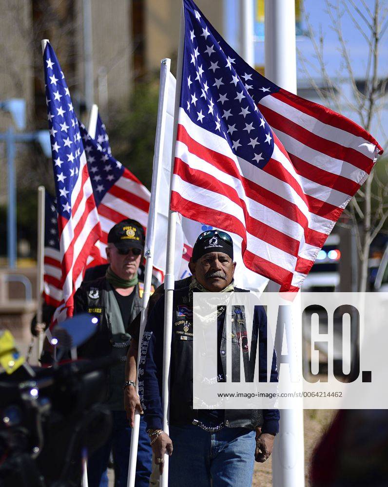 Albuquerque, NEW MEXICO, U.S. - 040215.Members of VFW carry U.S flags while on their way to attend the funeral of APD Officer John Kelly,<cq>, at the Albuquerque Convention Center .Photographed on Thursday April 2, 2015. Adolphe Pierre-Louis Journal. Albuquerque U.S. - ZUMAab1_