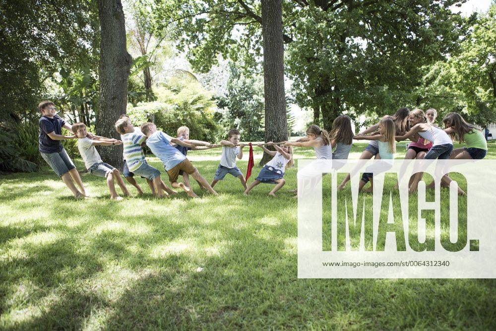 Boys and girls competing in tug of war model released Symbolfoto property released ZEF002825