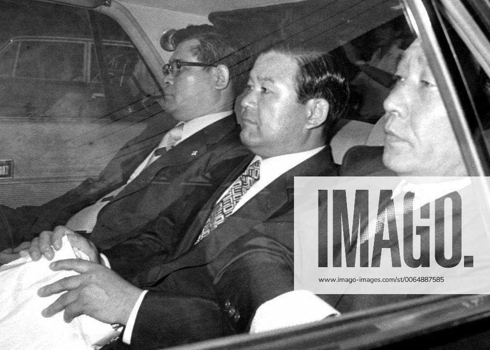 TOKYO, Japan - Former House of Representatives member Koko Sato (C) is transported to the Tokyo Detention House in August 1976 after being arrested over a high-profile bribery scandal involving Lockheed Corp. Sato died of biliary cancer on May 18, 2011, at the age of 83. 0519027