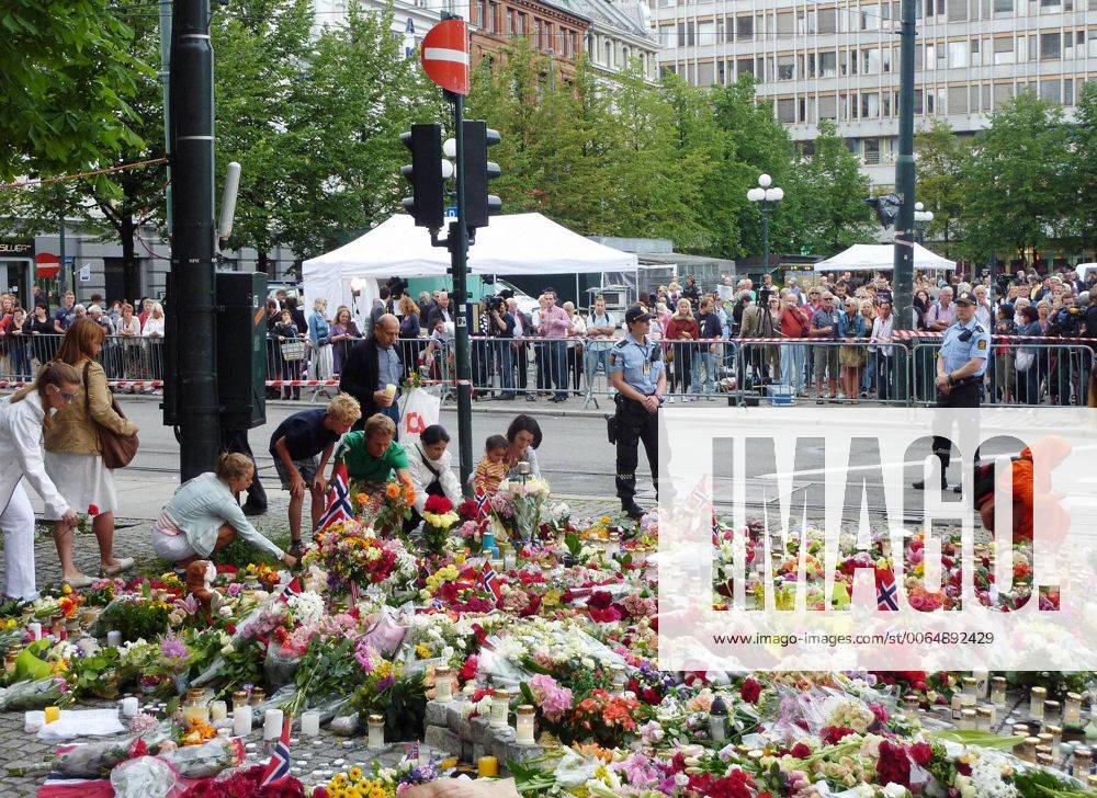 OSLO, Norway - People offer flowers near a cathedral in Oslo, Norway, on July 24, 2011. The cathedral held a mass the same day to mourn the dozens of victims of attacks by a man in Oslo and the island of Utoya on July 22. 0725007