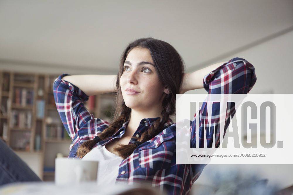 Portrait of young woman relaxing at home model released Symbolfoto property released RBF002896