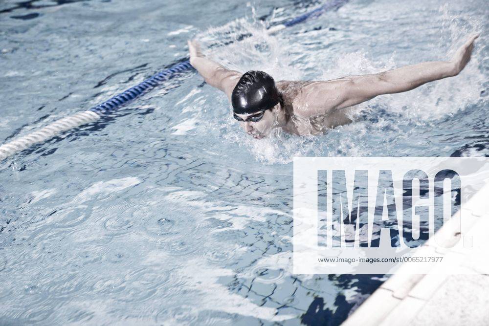 Swimmer training in indoor pool model released Symbolfoto property released ZEF004710