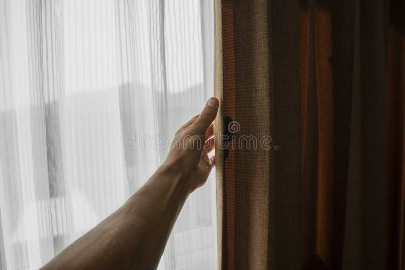 Men hand opening curtain in bed room., Men hand opening curtain in bed room